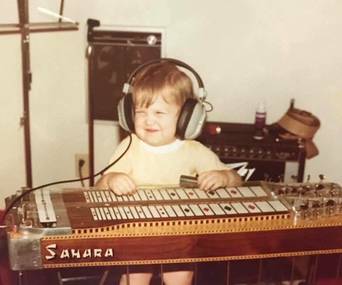 Jeremy as a little boy behind his grandfather's steel guitar
