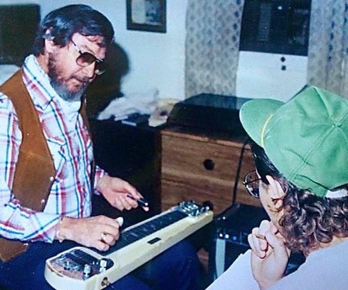 Wally Moyers Sr. giving Jeremy his first steel guitar lesson