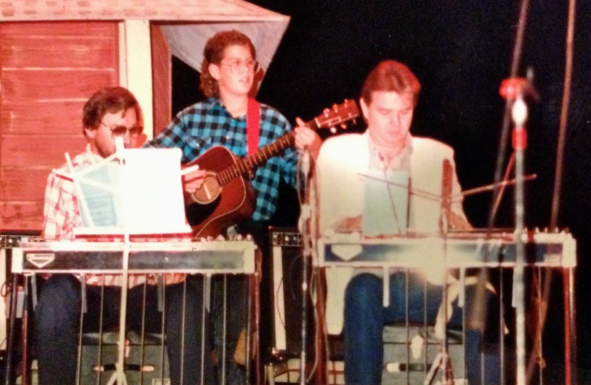 Jeremy Moyers performing on stage with his father and grandfather